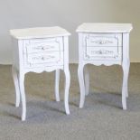 A pair of white painted bedside chests, on cabriole legs,