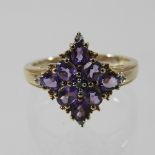 A 9 carat gold amethyst and diamond ring, boxed,