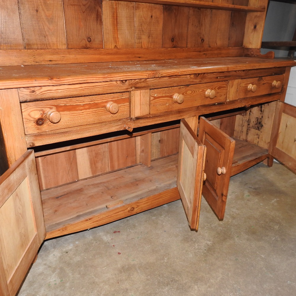 A pine dresser, the plate rack above drawers and cupboards, - Image 2 of 6