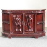 A painted side cupboard, carved with figures,