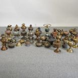 A large collection of mainly early 20th century oil lamps,