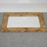 A rustic pine framed wall mirror,