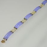 A 14 carat gold and lavender jade coloured hardstone bracelet