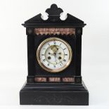 A Victorian black slate mantel clock,