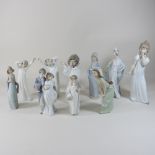 A collection of Lladro and Nao porcelain figures,