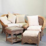 A wicker conservatory suite, comprising a sofa, 130cm, chair,