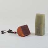 A reproduction oriental carved soapstone seal, 11cm high,