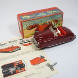 A Schuco vintage radio 4012, in the form of a toy car, 15cm long, boxed,