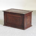 An oak chest, with a fall front,