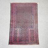 A Turkish woollen rug, with all over design, on a red ground,