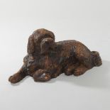 A wooden model of a sheepdog,