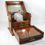 An Edwardian light oak and brass mounted decanter box,