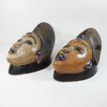 A pair of polychrome painted wooden Eastern masks,