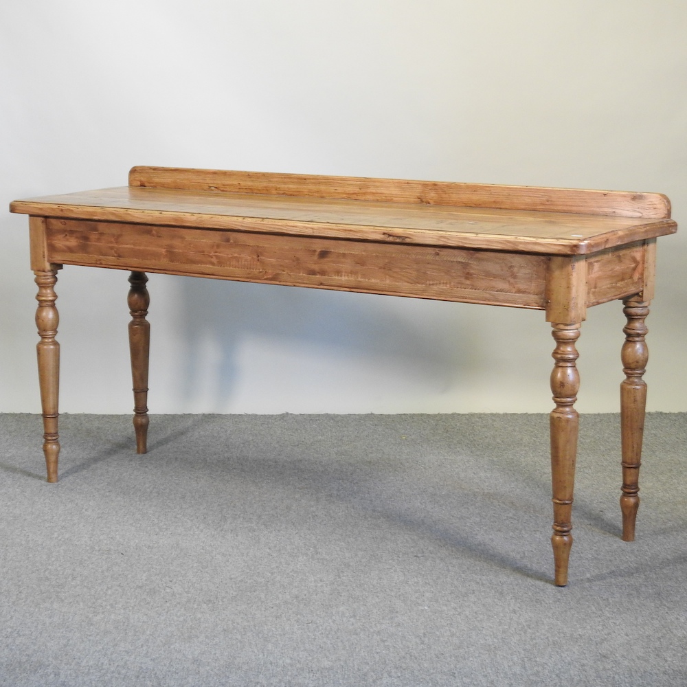 A hand made pine serving table, on turned legs,