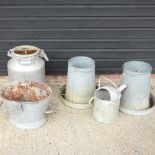 A pair of galvanised feeders, together with a planter and a milk churn,