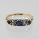 An 18 carat gold sapphire and diamond ring, boxed,