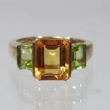 A 9 carat gold citrine and peridot ring, boxed,