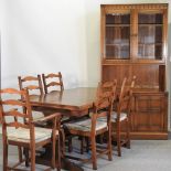 An Ercol draw leaf dining table dining table, 138 x 84cm, together with five Ercol dining chairs,