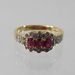 An 18 carat gold ruby and diamond ring, boxed,