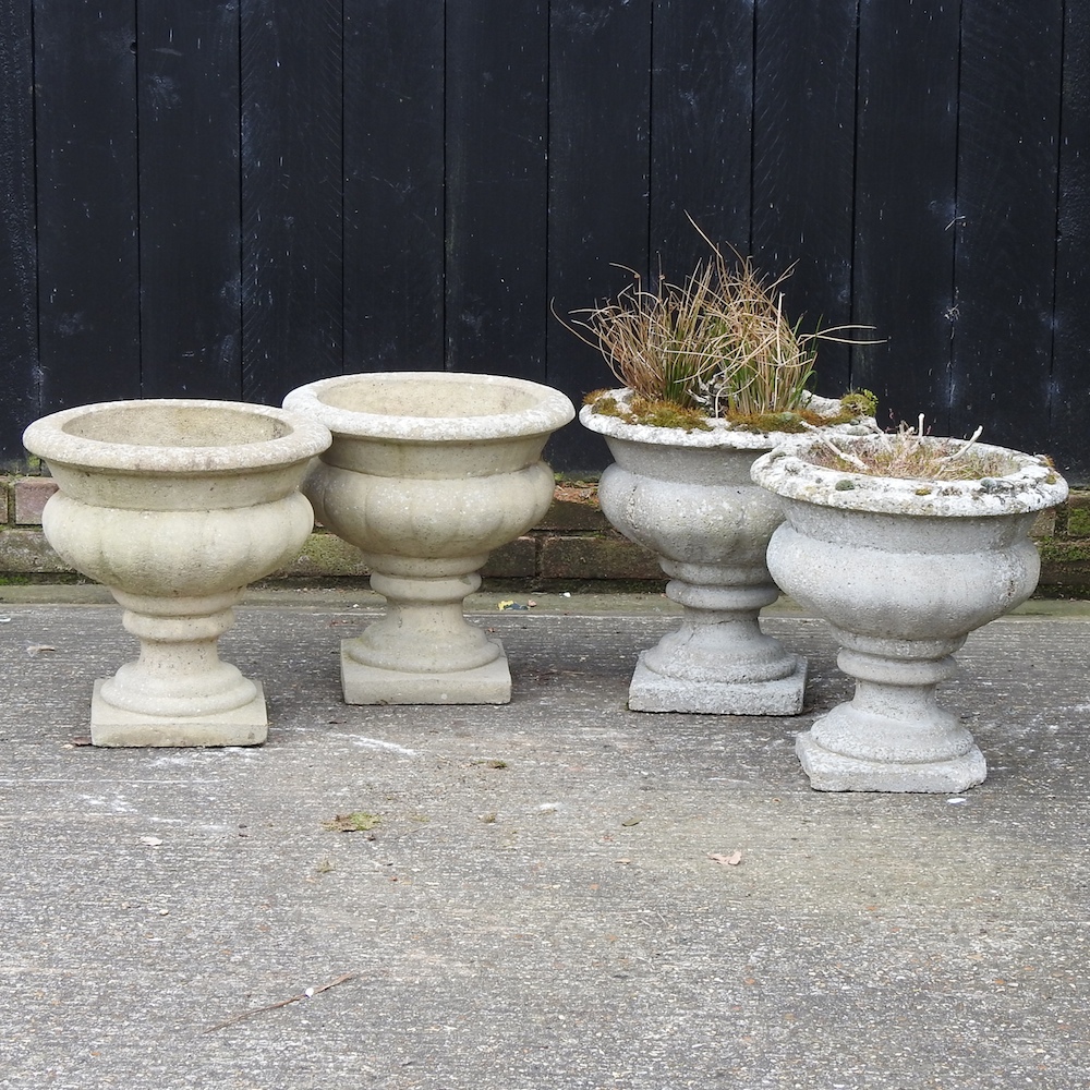 A pair of reconstituted stone planters, 39cm diameter,