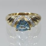 A 9 carat gold light blue topaz and diamond ring, boxed,