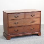 An Edwardian mahogany and inlaid dressing chest, on a plinth base,