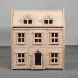 A modern wooden doll's house, 64cm,