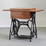 A 19th century sewing machine table,