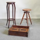 An early 20th century adjustable stool, together with an Edwardian mirror back hanging cabinet,