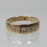 A 14 carat gold half hoop eternity ring, set with five diamonds, boxed,