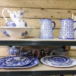 Two shelves of blue and white china,