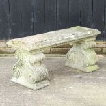 A reconstituted stone garden bench,