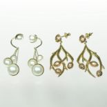 A pair of Dior gilt pearl earrings, each suspended with four graduated white pearls,