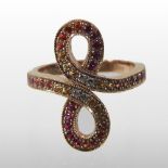 A Lalique 18 carat gold ruby and diamond ring, of crossover design,