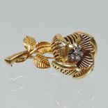 A diamond seven stone floral brooch, in the form of an opening flower head,
