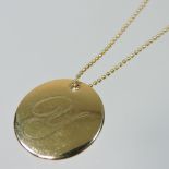 A Tiffany & Co 18 carat gold disc pendant, inscribed with the letter Y, 2cm diameter,