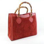 A Gucci red leather and suede 'Diana' satchel bag, with bamboo handles,
