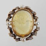 *Withdrawn* A 19th century unmarked carved citrine, pearl and diamond cameo brooch, of oval shape,