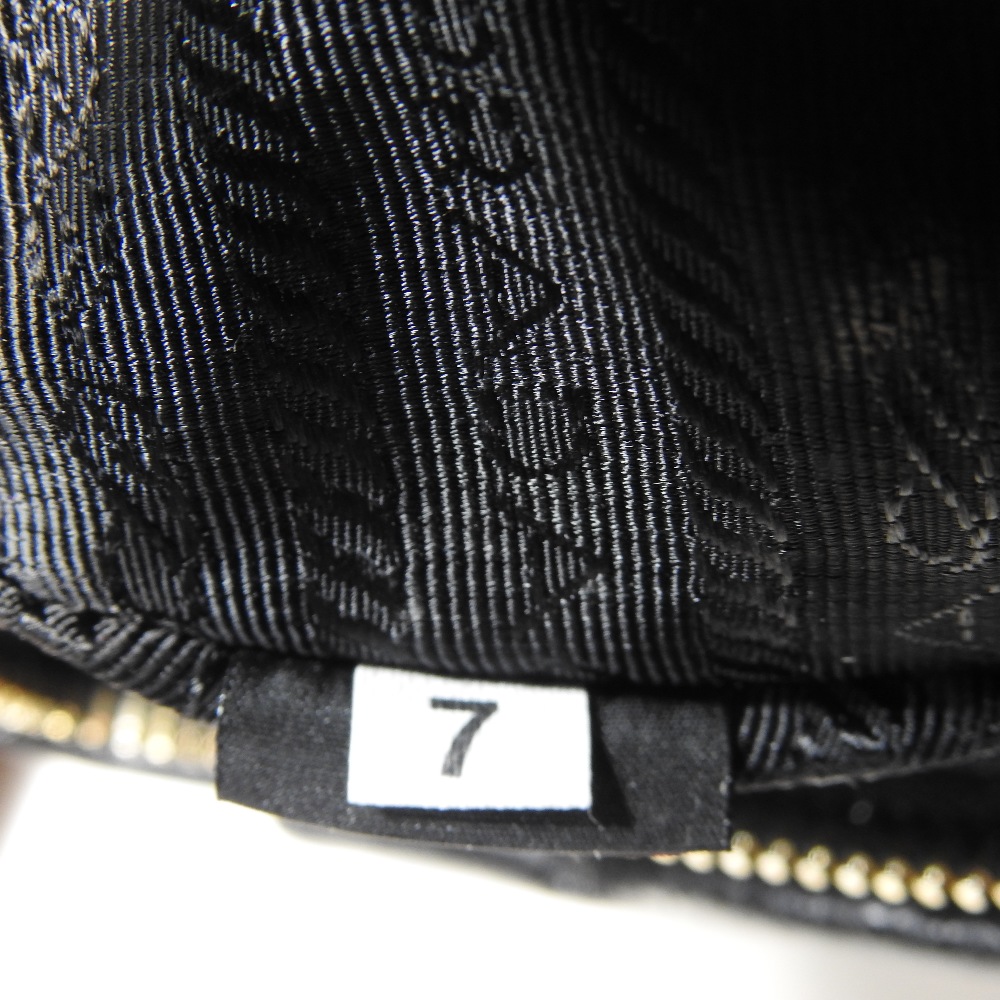 *Withdrawn* A Prada black leather clutch bag, 21cm, together with a Christian Dior cream clutch bag, - Image 10 of 34