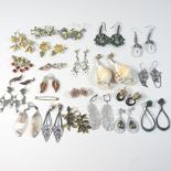 A large collection of various designer and costume earrings to include a pair of Butler & Wilson