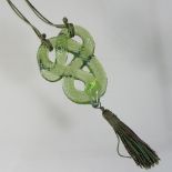 A modern Lalique green frosted glass necklace, in the form of a coiled snake, 7cm high,