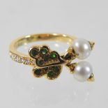 A Dior 18 carat gold, emerald, peridot, pearl and diamond articulated ring, of oak leaf design,