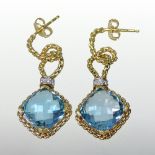 A pair of 18 carat gold, blue topaz and diamond articulated pendant earrings,