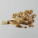 A Tiffany & Co 18 carat gold brooch, in the form of a spray of flowers, 5cm long, 9.