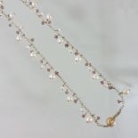 A modern pearl single strand necklace, set with alternating sized pearls and crystals,