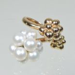 A Boucheron 18 carat two colour gold pearl ring, of triple cluster design, numbered E53066,