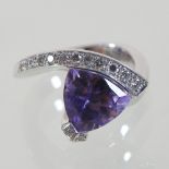A Joia 18 carat gold, amethyst and diamond ring, of scrolled triangular shape,