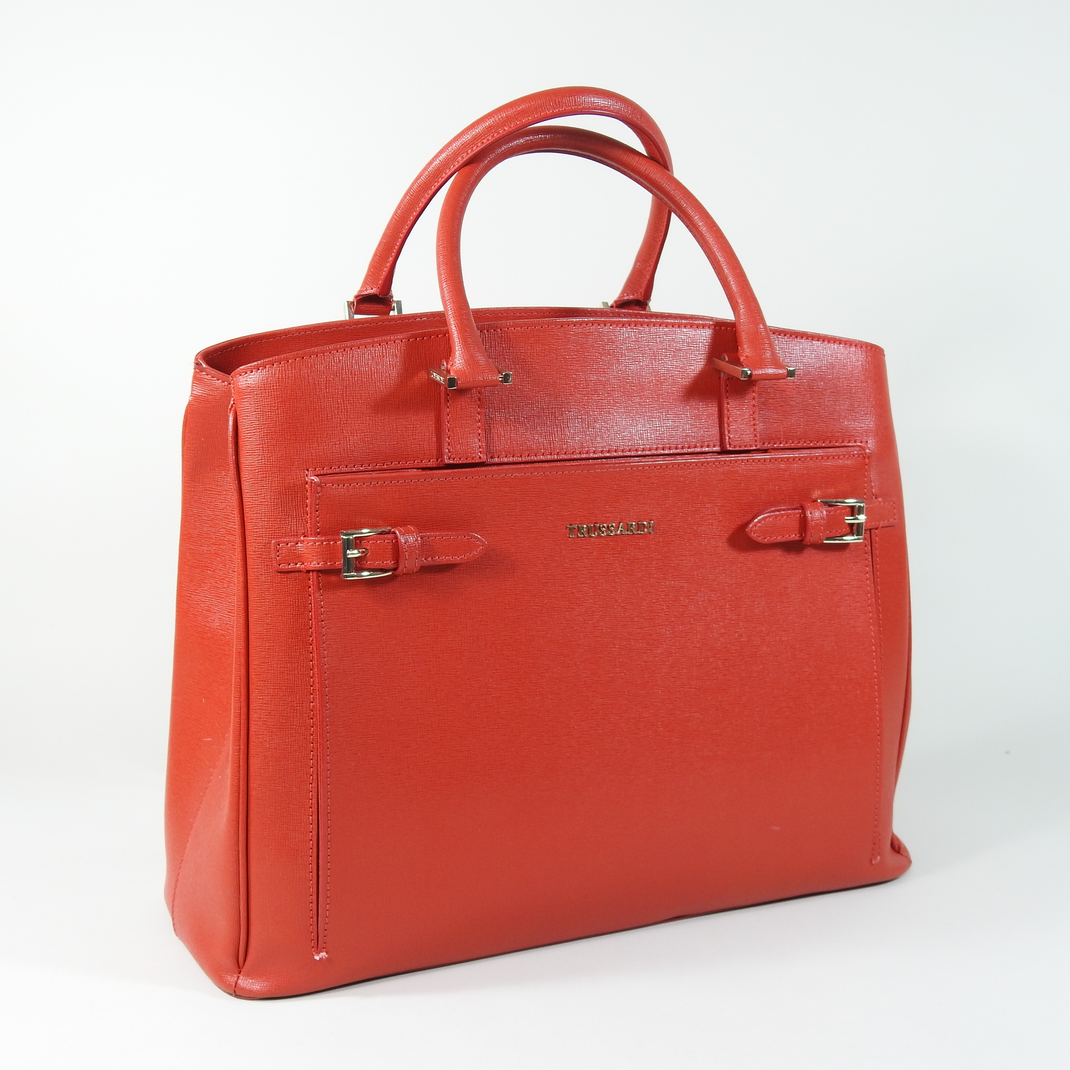 A Trussardi red leather handbag, decorated with buckles,