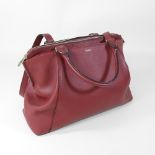 *Withdrawn* A Cartier red leather handbag, with shoulder strap,