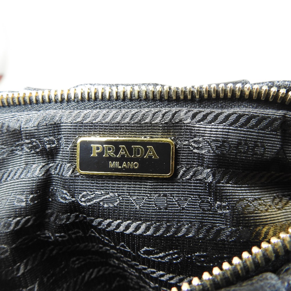 *Withdrawn* A Prada black leather clutch bag, 21cm, together with a Christian Dior cream clutch bag, - Image 5 of 34